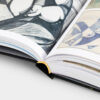 Fragment publikacji ,,Mapy wyobraźni. Surrealne światy Jerzego Skarżyńskiego''. Na stronach widoczne fragmenty dział artysty.